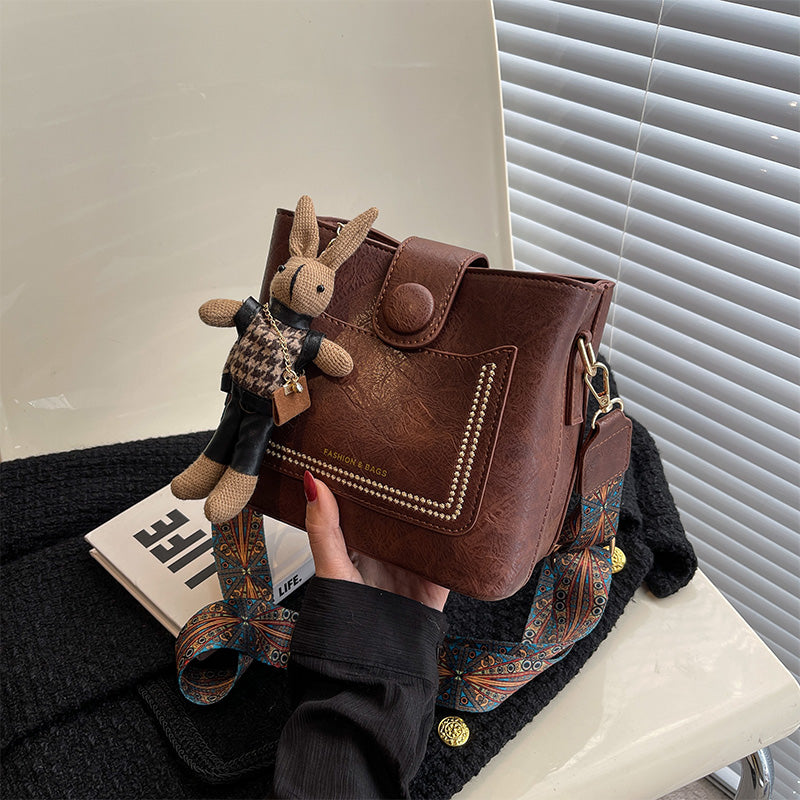 Vintage Style PU Leather Bucket Bag with Wide Patterned Strap & Optional Bunny Charm(black)