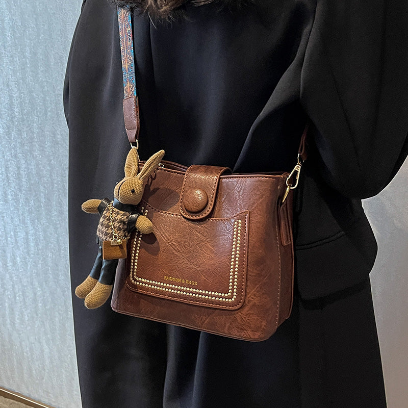 Vintage Style PU Leather Bucket Bag with Wide Patterned Strap & Optional Bunny Charm(black)